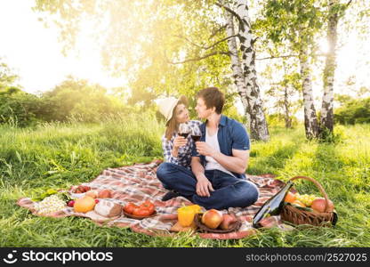 couple love picnicking meadow