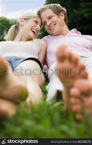 Couple lying in a field