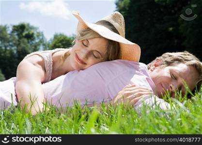 Couple lying in field