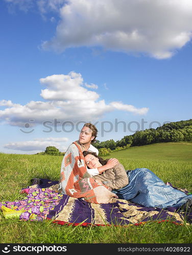 couple lying in field