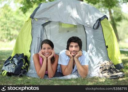 Couple lying in tent