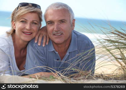 Couple lying in the dunes