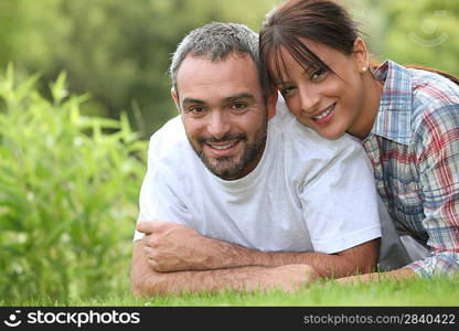 Couple lying in the grass