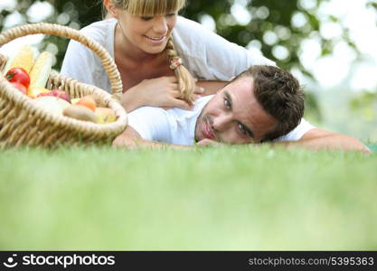 Couple lying in the grass