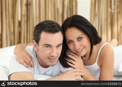 Couple lying on a bed