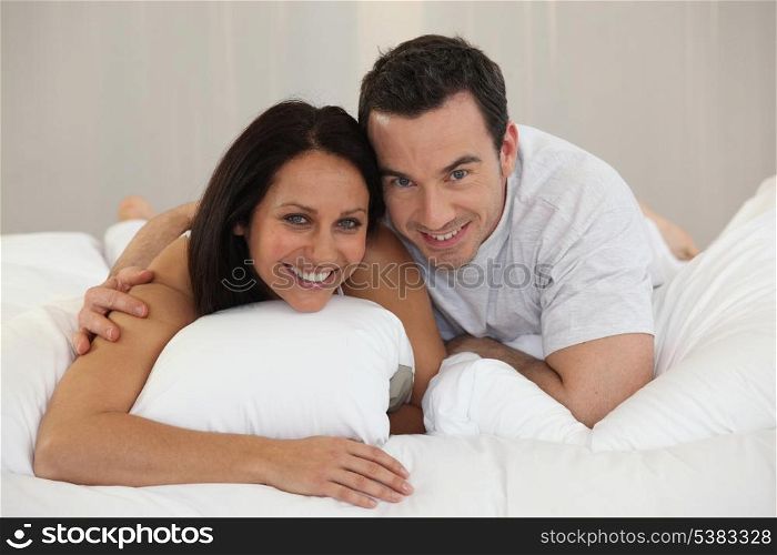 Couple lying on a bed