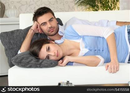 Couple lying on a couch together