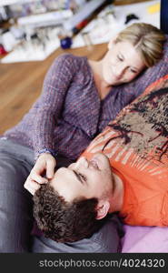 couple lying on couch caressing