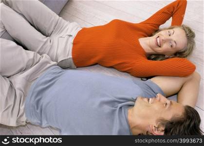 Couple lying on floor