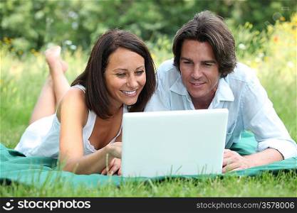 Couple lying on the grass