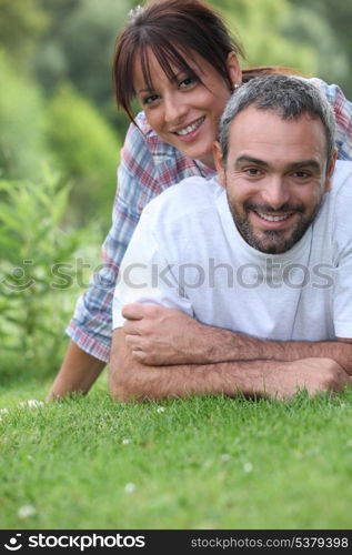 Couple lying on the grass