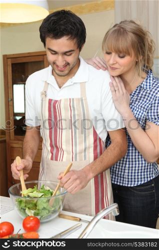 Couple making a salad