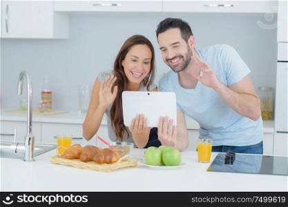 Couple making a video call using a tablet