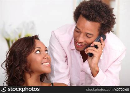 Couple making telephone call