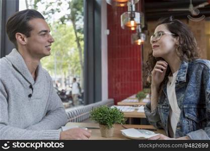 Couple Meeting In Busy coffee shop Restaurant