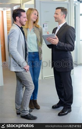 couple meeting salesman