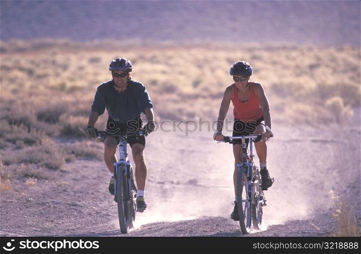 Couple Mountain Biking Together