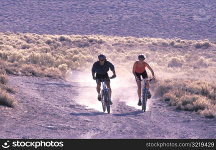 Couple Mountain Biking Together