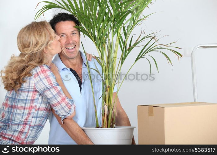 Couple moving in with plant