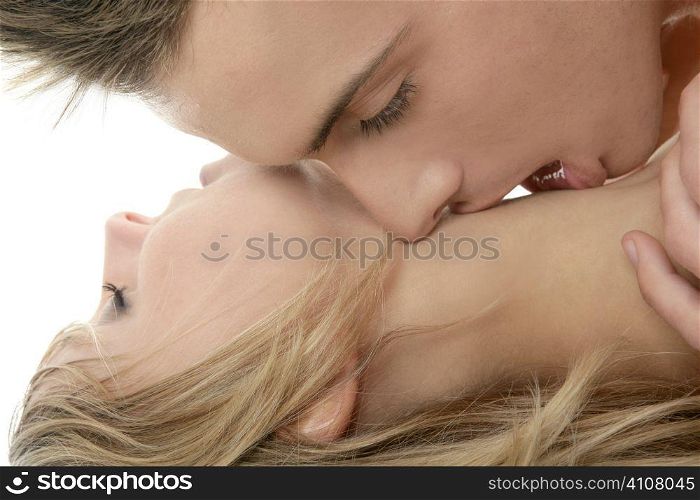Couple natural kiss close up portrait over white background