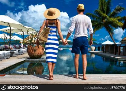 Couple near poolside jetty at Seychelles
