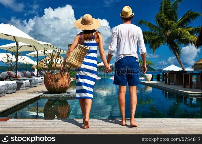 Couple near poolside jetty at Seychelles