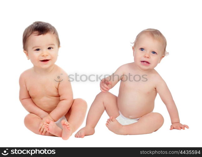 Couple of babies sitting on the floor isolated on a white background