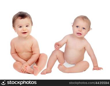 Couple of babies sitting on the floor isolated on a white background
