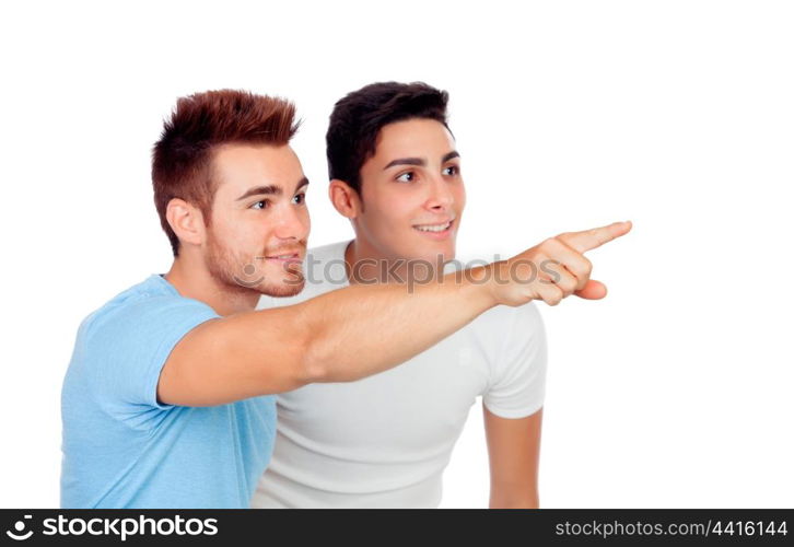 Couple of best friends pointing something isolated on a white background