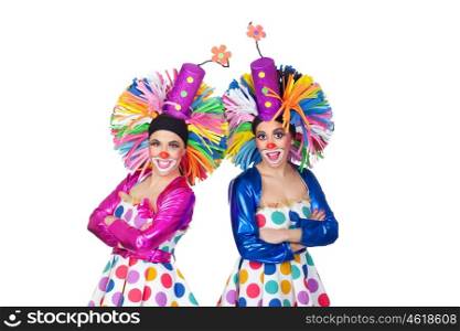 Couple of funny clowns with big colorful wigs isolated on white background