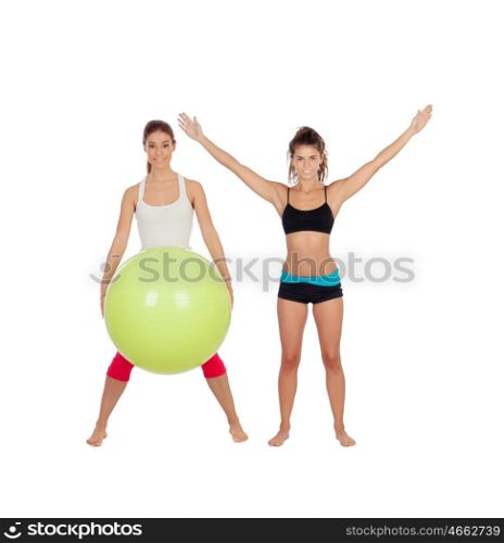 Couple of girlfriends with fitness clothes isolated on a white background