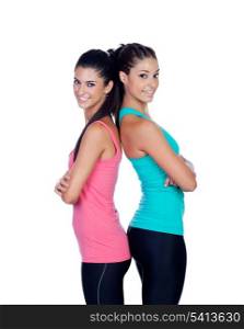 Couple of girlfriends with fitness clothes isolated on a white background