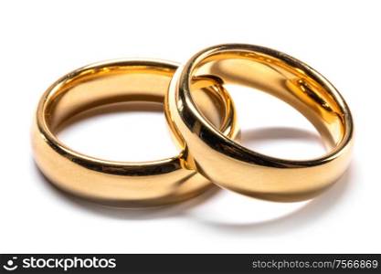 Couple of gold wedding rings isolated on white background. Gold wedding rings on white