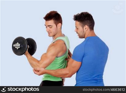 Couple of handsome muscled on a blue background