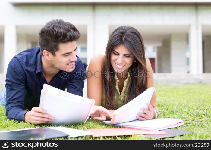 Couple of happy students at the university campus