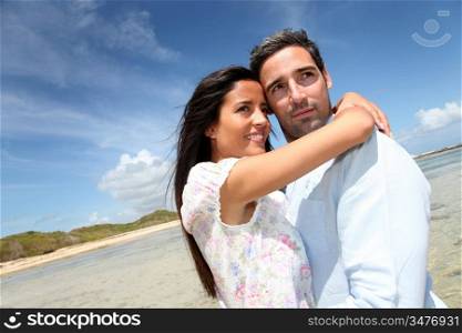 Couple of lovers embracing each other at the beach