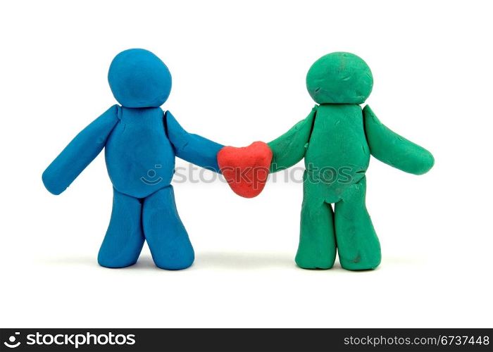 couple of lovers hold red heart . made from plasticine