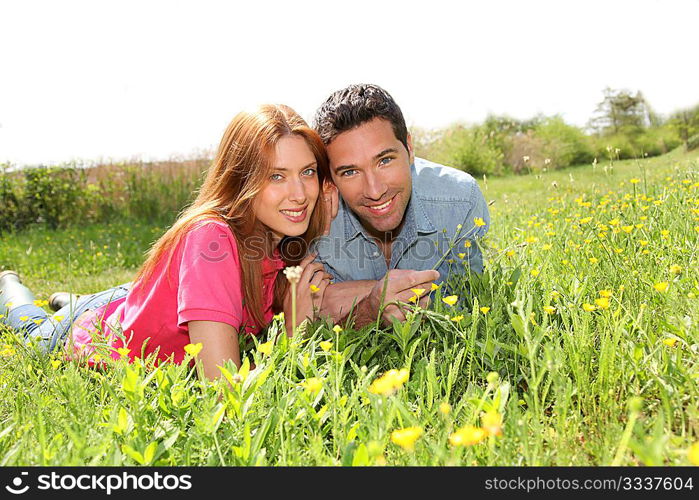 Couple of lovers laying donw in park