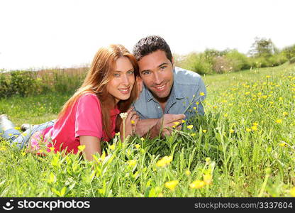 Couple of lovers laying donw in park