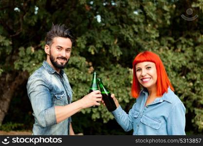 Couple of lovers toasting for their love in the landscape