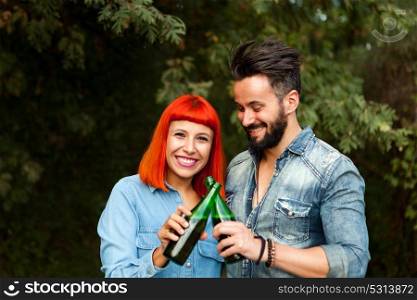 Couple of lovers toasting for their love in the landscape
