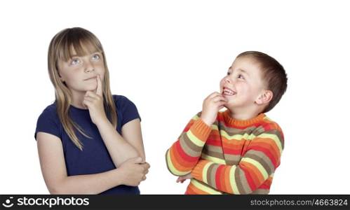 Couple of pensive children looking up isolated on a white background