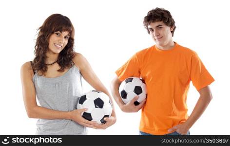 Couple of teenagers with soccer balls a over white background