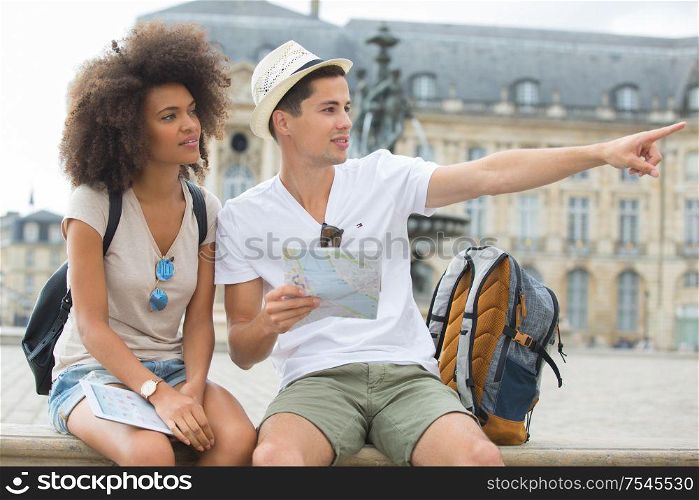 couple of tourist with city map