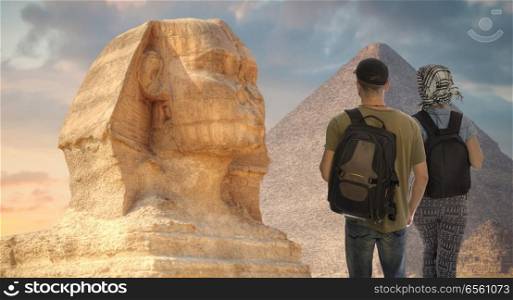  couple of tourists travel around the city to the pyramids of Giza. Egypt.