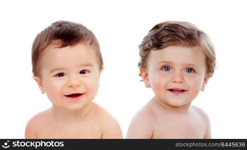 Couple of twins babies, girl and boy, sitting isolated on a white background
