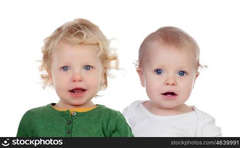 Couple of twins sitting on the floor isolated on a white background