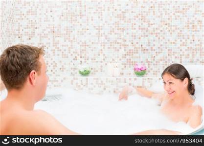 couple of young lovers together in Jacuzzi