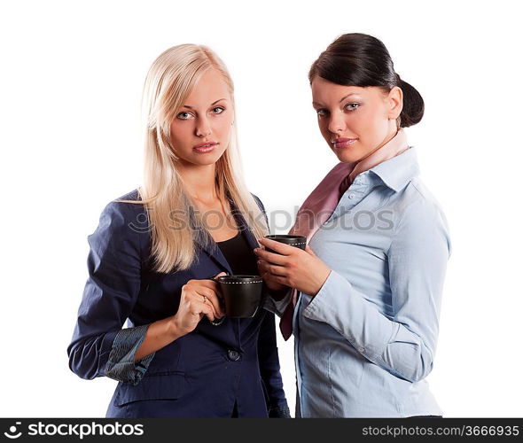 couple of young pretty woman in formal dress and a cup of tea