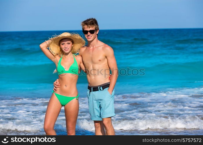 Couple of young tourists in a tropical summer beach